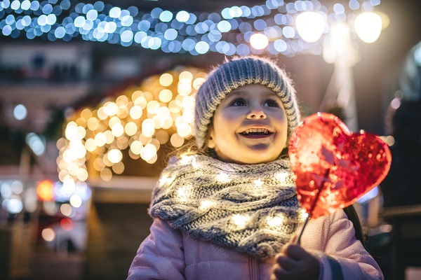 Christmas time - little girl with christmas lights
